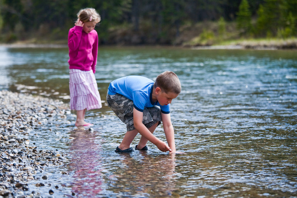 Kids playing in creek